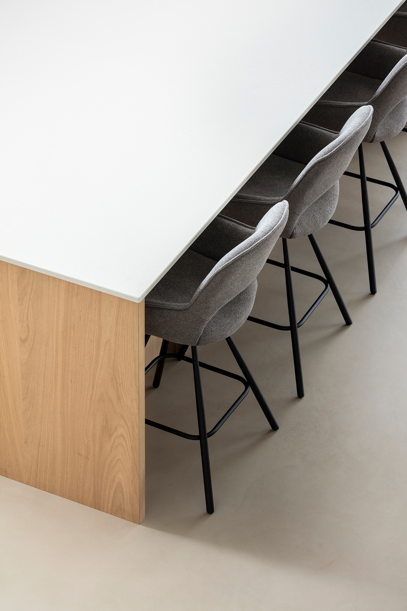 Kitchen island seating, and view of cement floors.